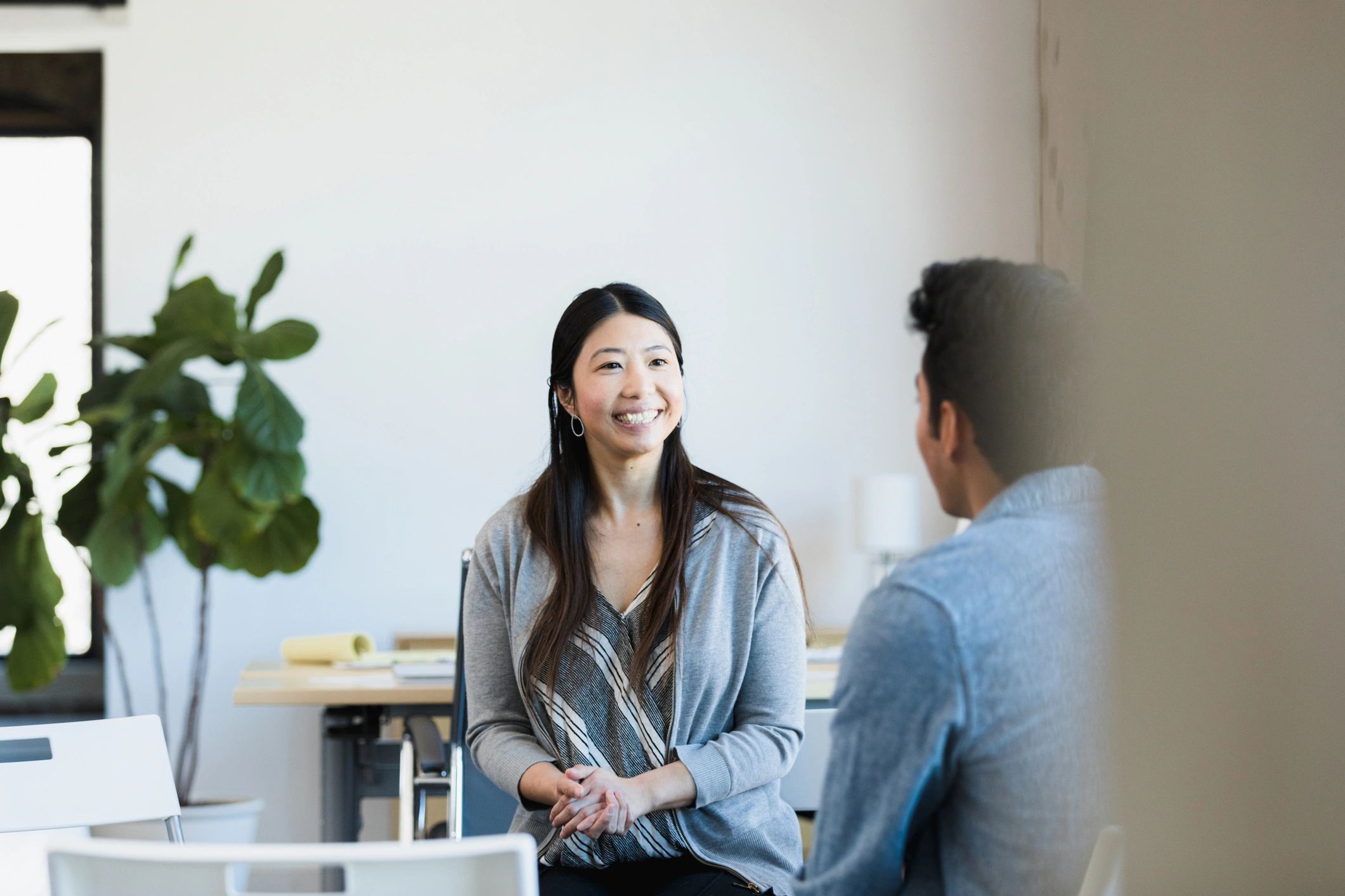 Consultant meeting with a business leader in an office