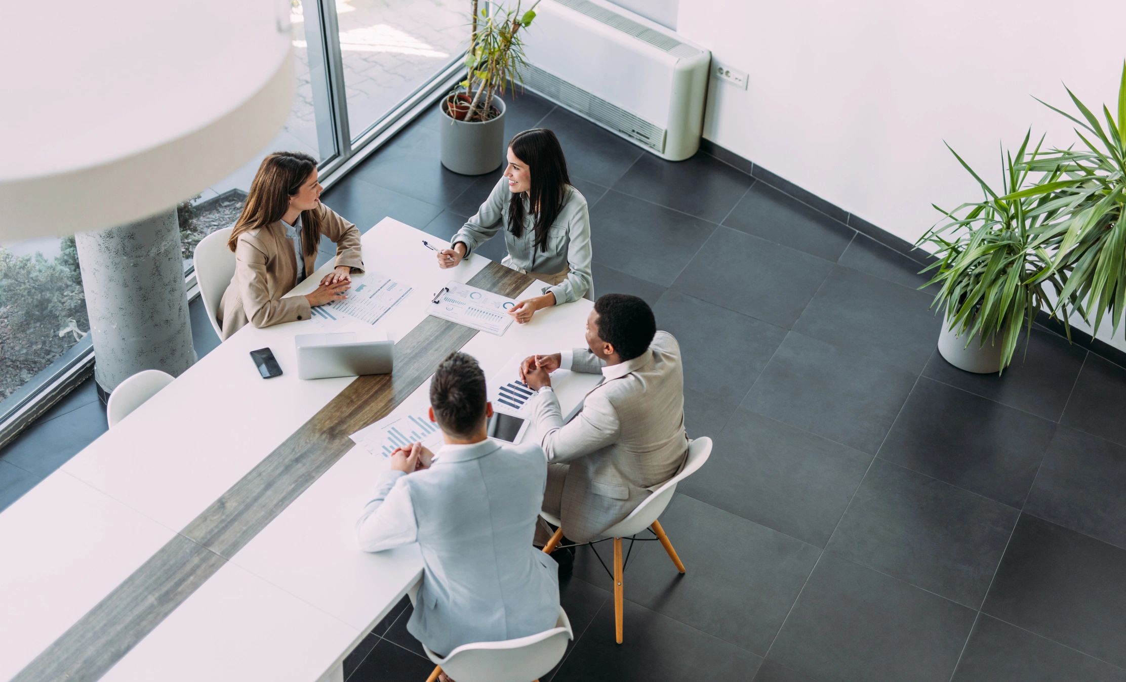 Overhead view of business team meeting around a table